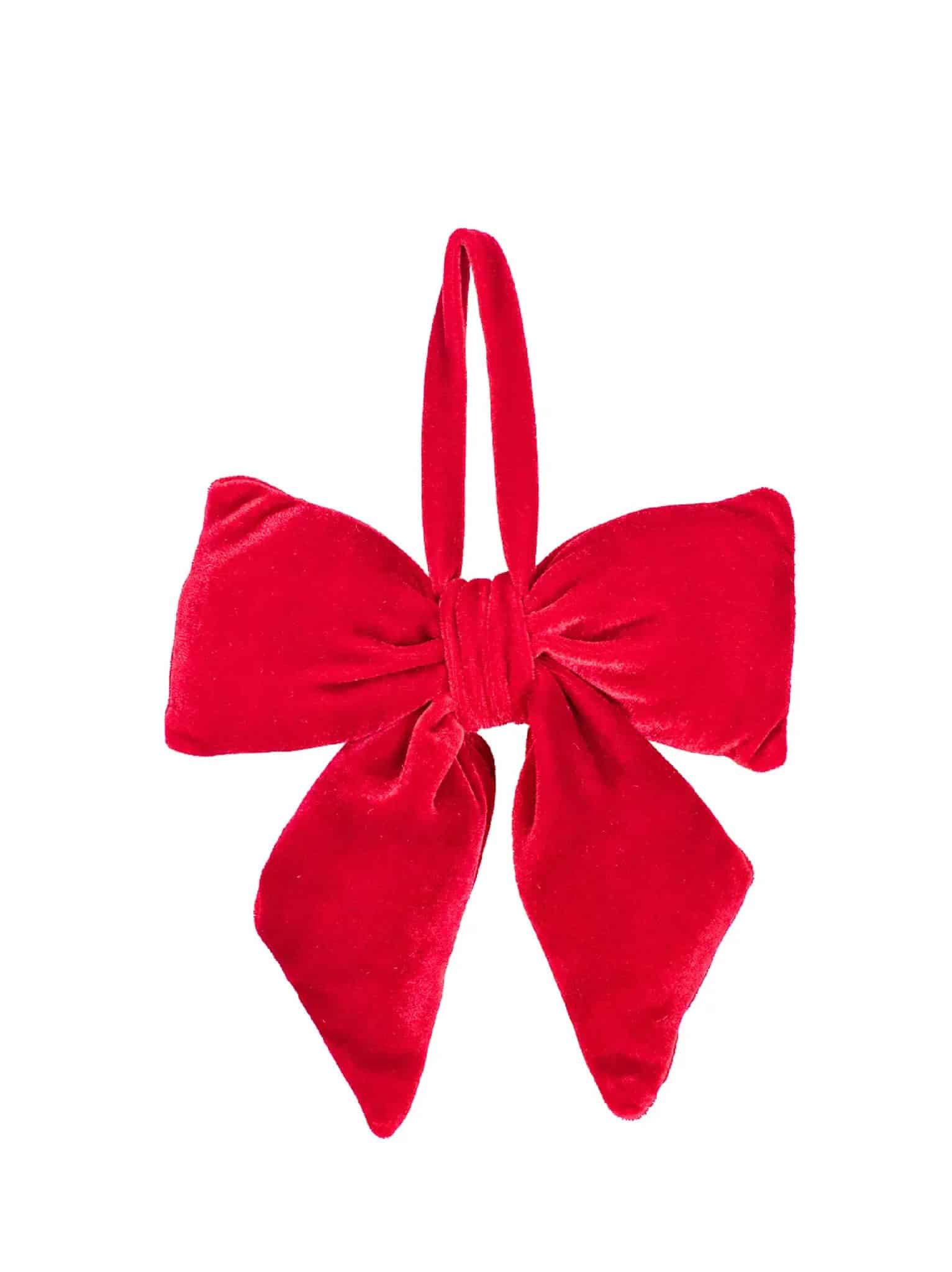 Velvet red bow ornament with hanging loop, featuring a full shape and smooth texture against a white background.