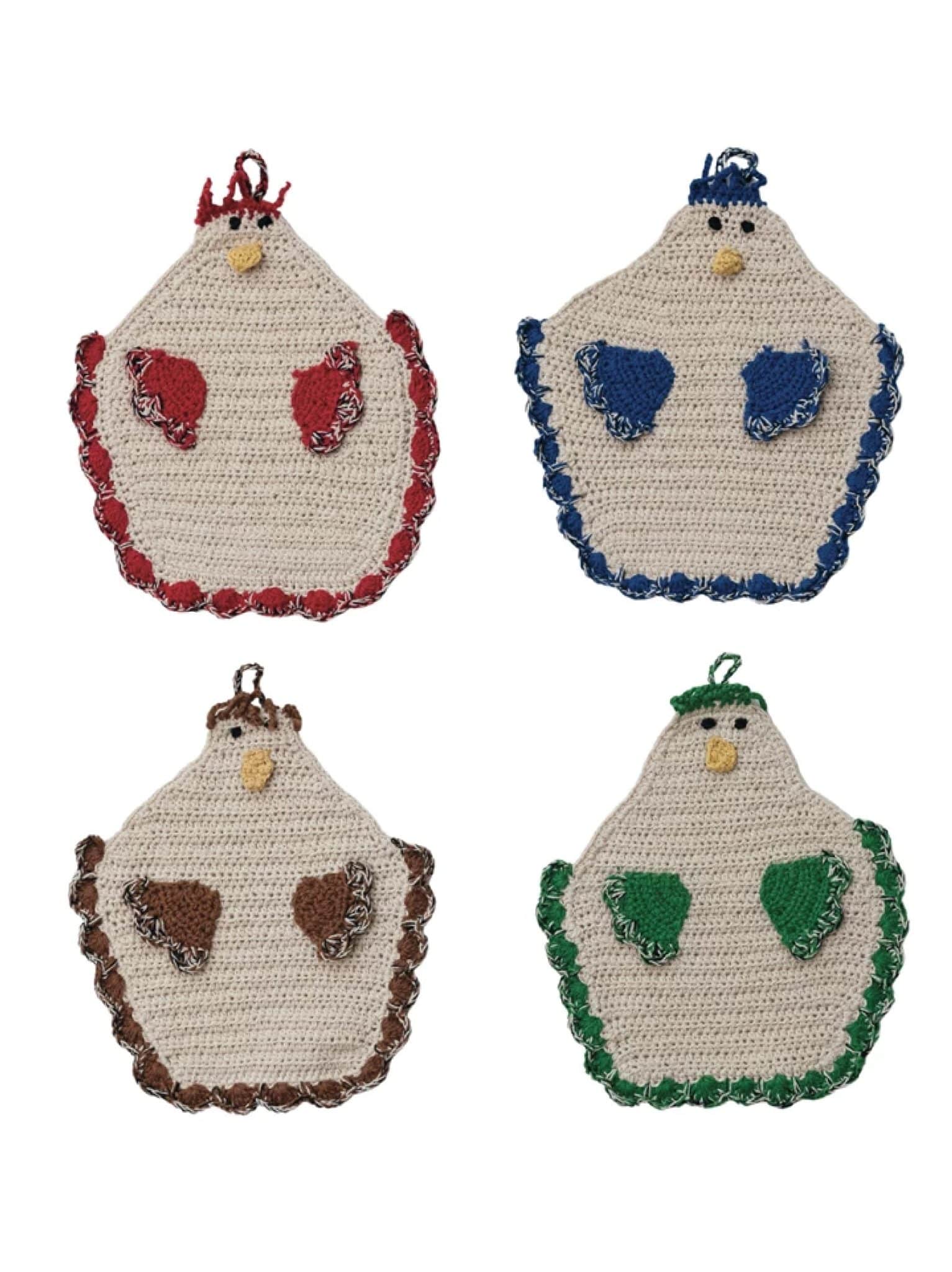 Four crocheted chicken-shaped potholders with colorful trim and wings in red, blue, brown, and green.