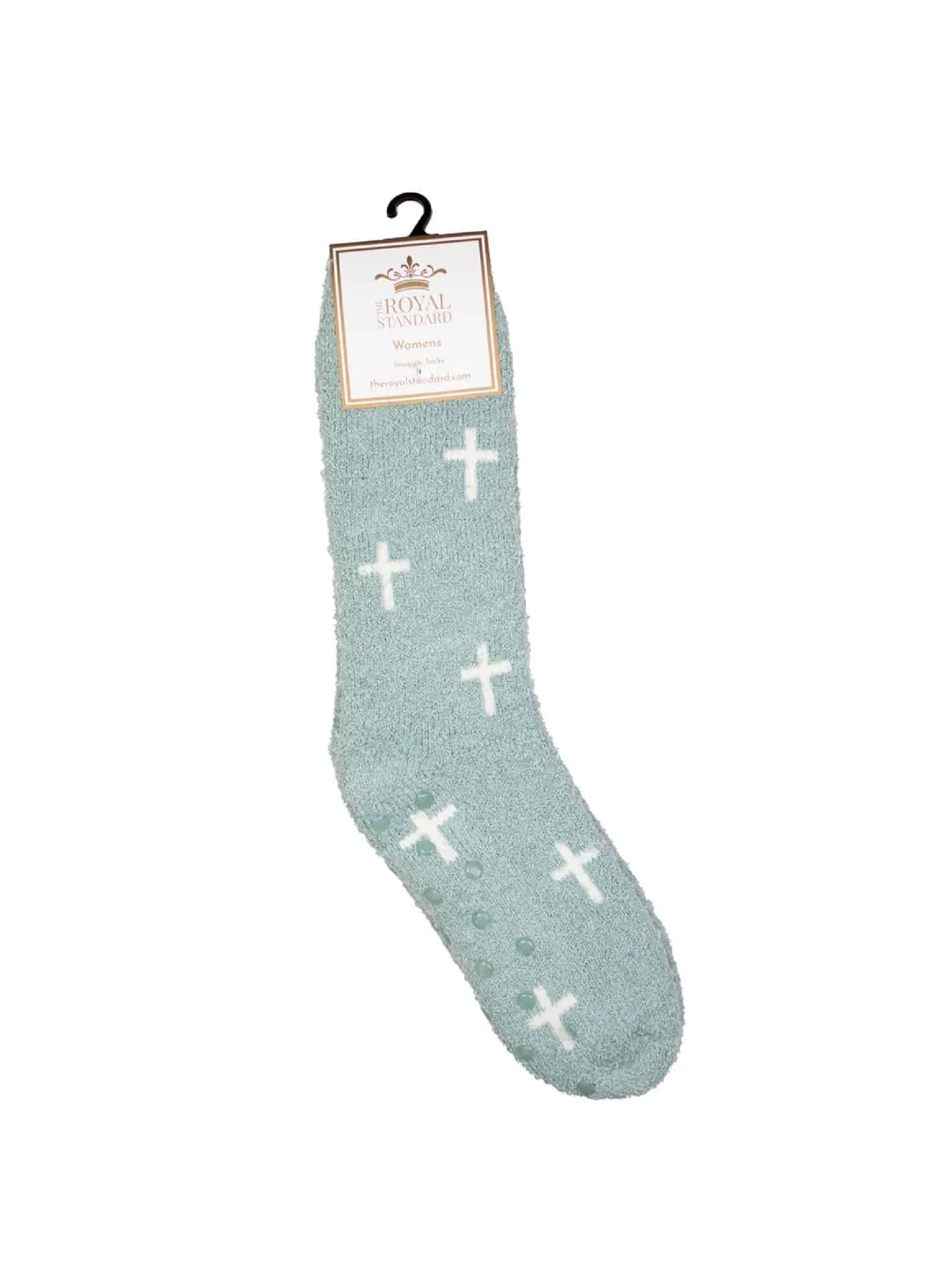 be-made-hays-ks-blue-and-white-cross-fuzzy-socks Blue fuzzy socks with white cross pattern and The Royal Standard packaging labeled “Women’s Snuggle Socks.”