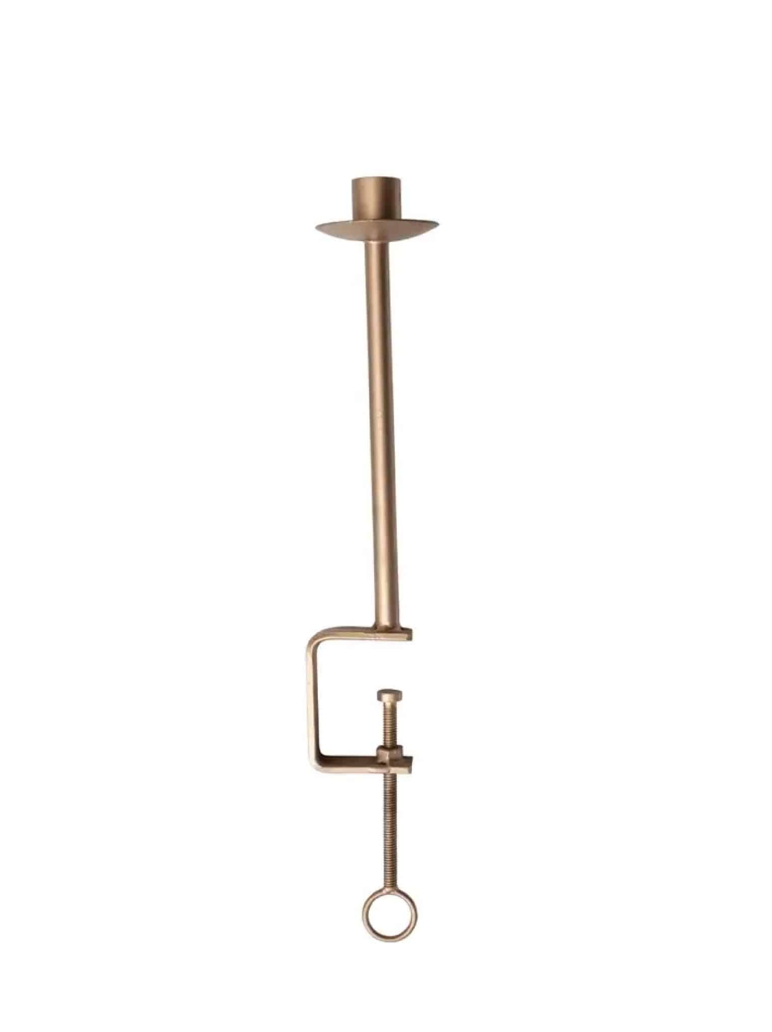 Single gold clamp taper candle holder with antique finish, designed to attach to surfaces like tablet edges or shelves.