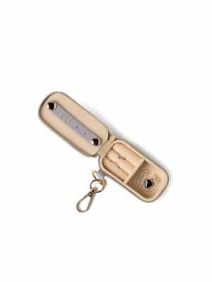 Open Jewelry Keychain case showing ring slots, stud bar, and small compartment.