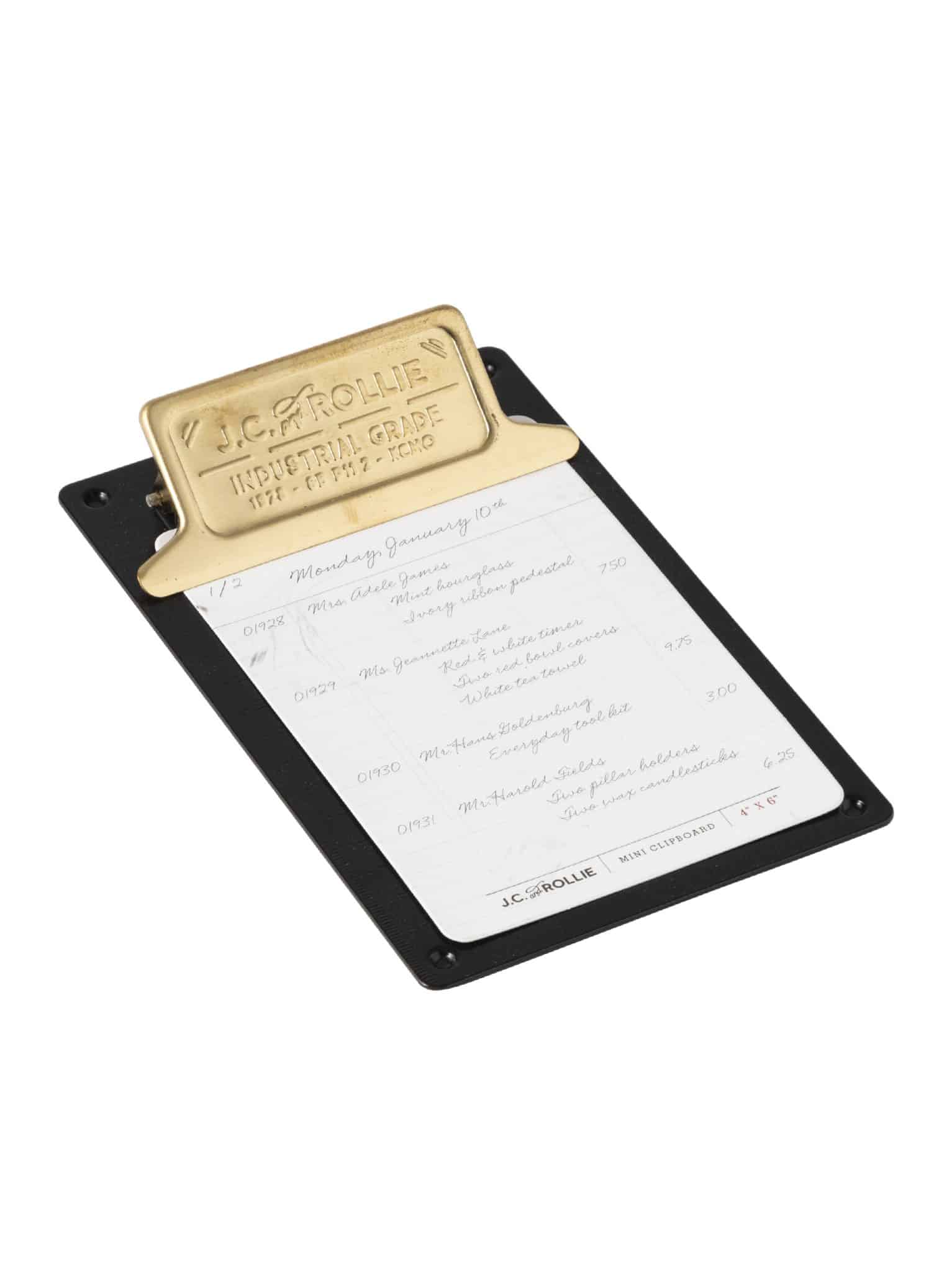 Angled view of mini clipboard with vintage-style brass clip and matte black base
