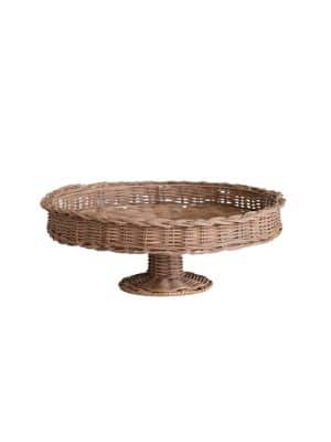 Angled image of hand-woven rattan pedestal stand with round woven top and short footed base, shown on white background.