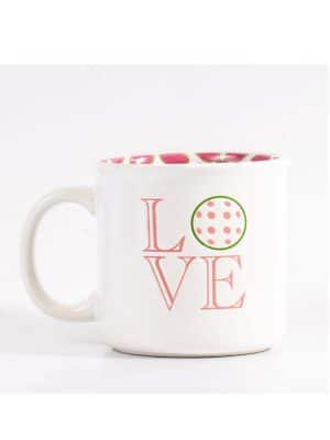 Front view of Love Pickleball Mug with the word LOVE and a pickleball design as the “O,” featuring a pink paddle and ball interior pattern.