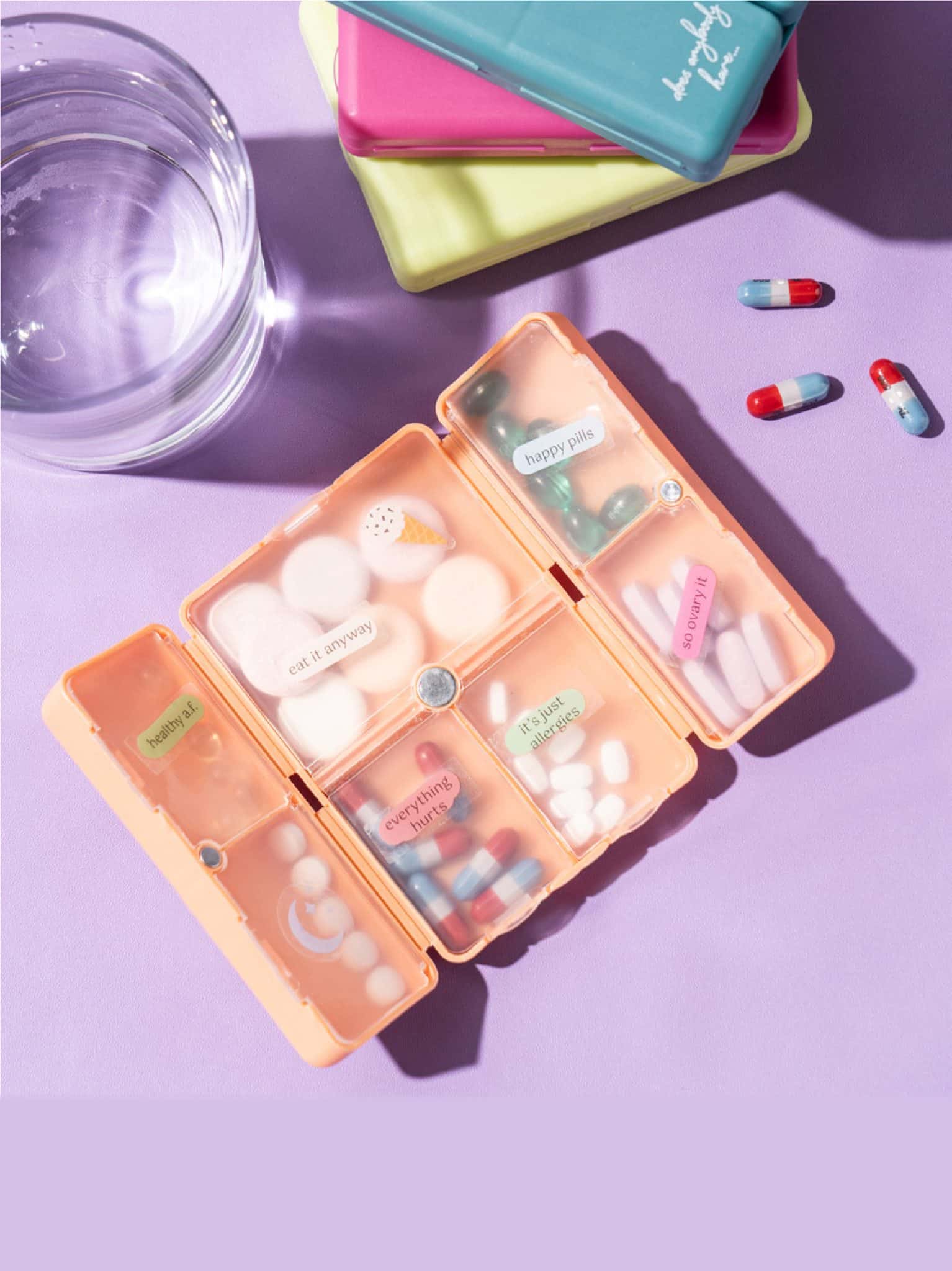 Open Pill & Vitamin Case showing seven compartments filled with vitamins and pills.