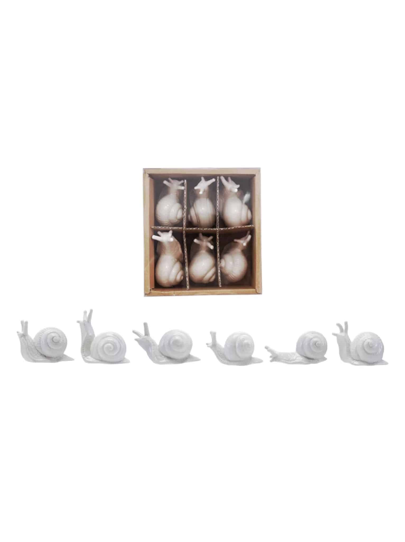 Boxed set of white ceramic mini snails with additional snails lined beside it
