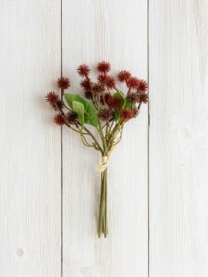 Burgundy Mini Thistle Bundle with multiple faux stems and green leaves tied together, styled on a white wood background.