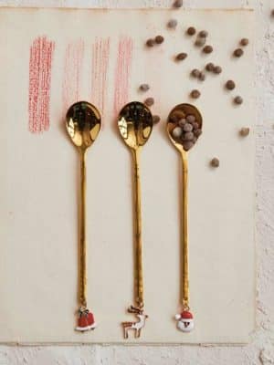 Mini gold spoon with reindeer charm on the handle, 5.25 inches long, ideal for coffee or cocoa.