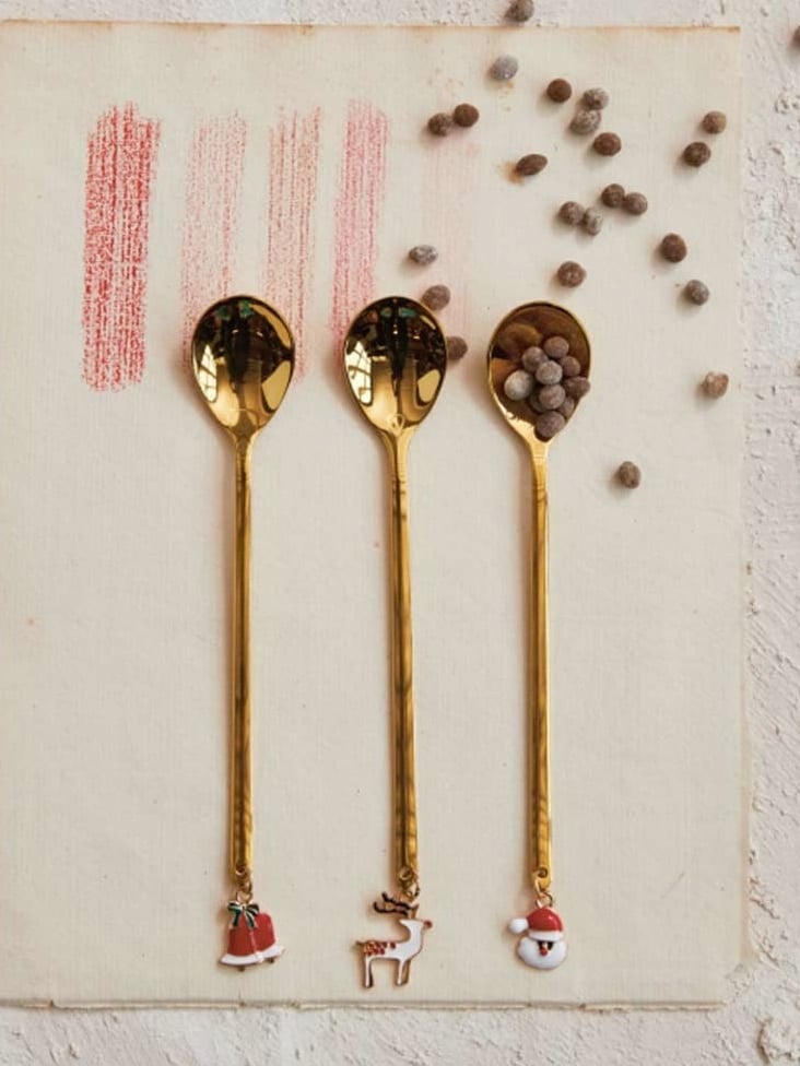 be-made-hays-ks-mini-gold-spoon-with-reindeer-charm Mini gold spoon with reindeer charm on the handle, 5.25 inches long, ideal for coffee or cocoa.