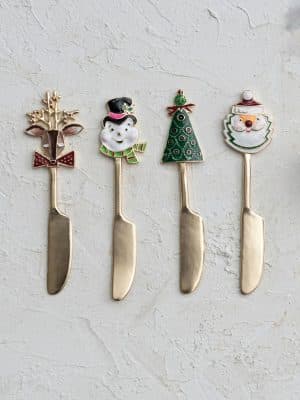 Set of four Christmas Spreader Knives featuring reindeer, snowman, Christmas tree, and Santa handles with gold blades.