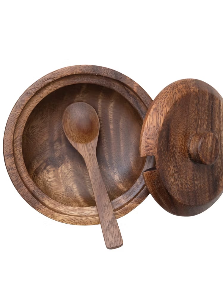 Top-down view of acacia wood bowl with the lid off and a small spoon resting inside.