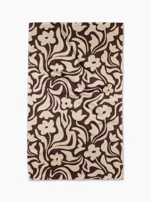 Floral Reverie Geometry Towel with chocolate brown and cream floral swirl design, absorbent and quick-drying.