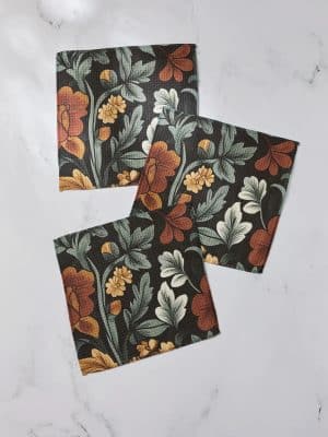 Geometry 3-pack dishcloths in vintage floral design with rust, tan, and cream flowers on black.