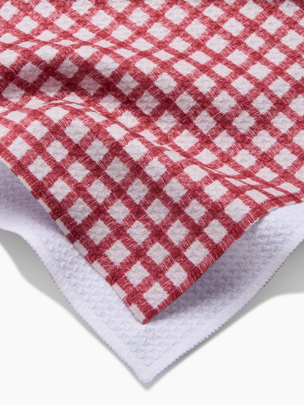 Fireside Plaid Red Geometry kitchen towel featuring a red checkered pattern and hanging loop.