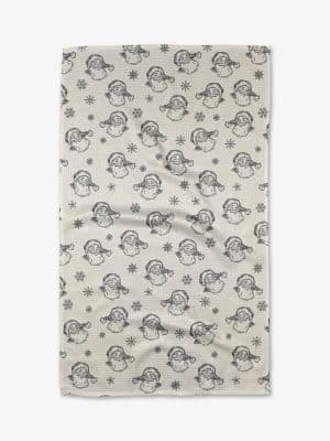 Vintage Santa Geometry towel with black-and-white Santa faces and snowflakes on a white background.