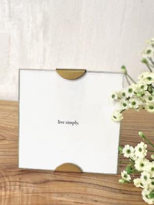 Live Simply Scallop Frame on wood with flowers