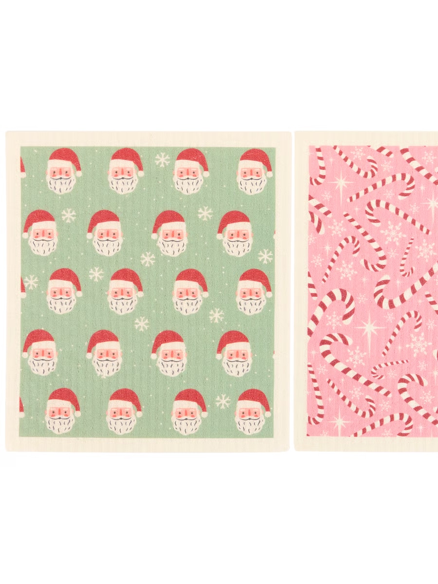 Green Swedish dishcloth with repeating Santa Claus faces.
