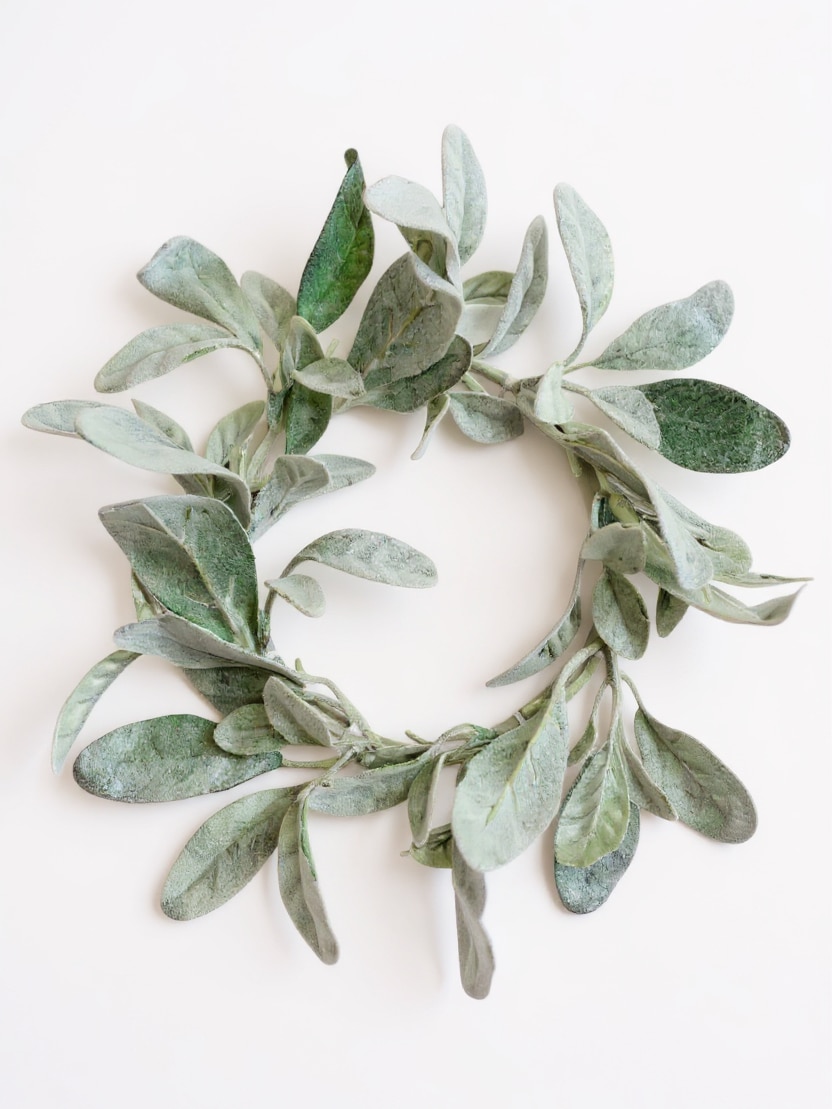 Lamb’s Ear Candle Ring with soft frosted green leaves arranged in a natural circular design, styled against a white shiplap background.