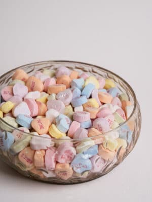 Hand-Blown Glass Hobnail Bowl shown filled with pastel candy in a close-up view