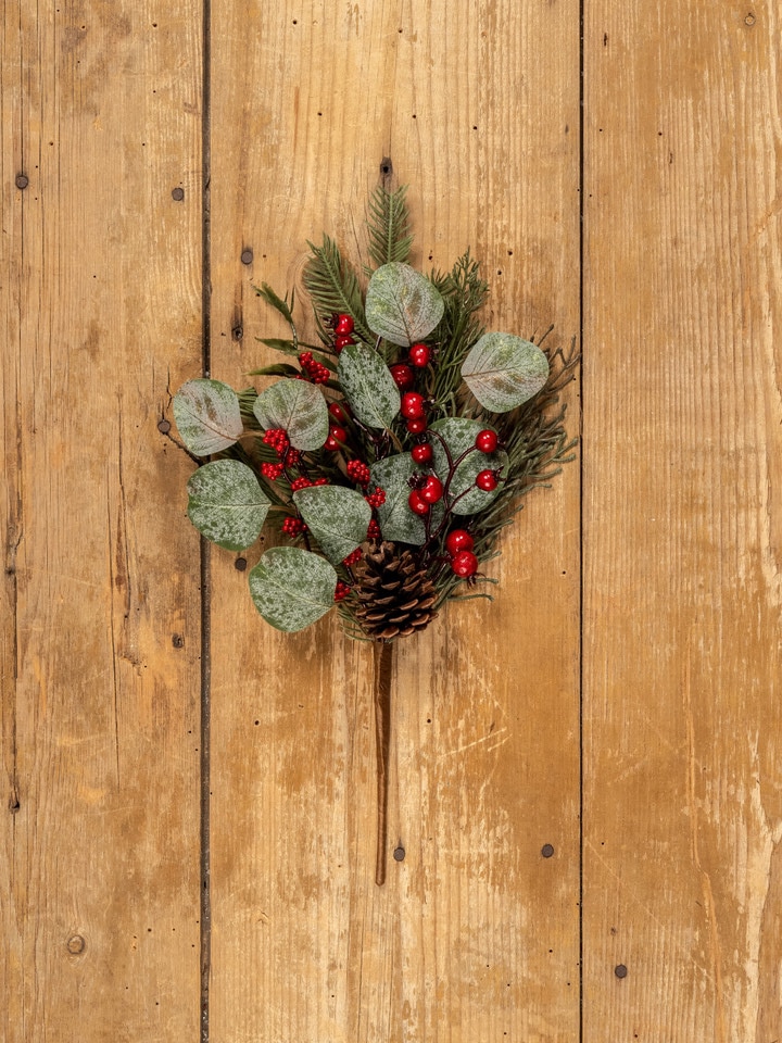 Holiday eucalyptus berry pine pick with faux greenery, red berries, and pinecone.