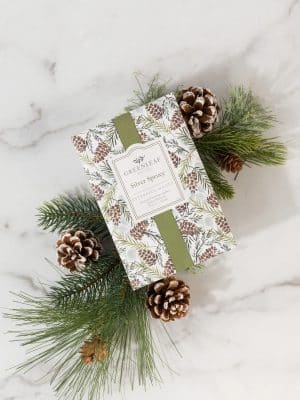 Silver Spruce scented sachet packet with winter greenery and pinecone design.