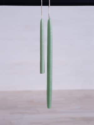 Succulent Skinny Taper Candles in a delicate green hue, hand-dipped with a narrow silhouette.