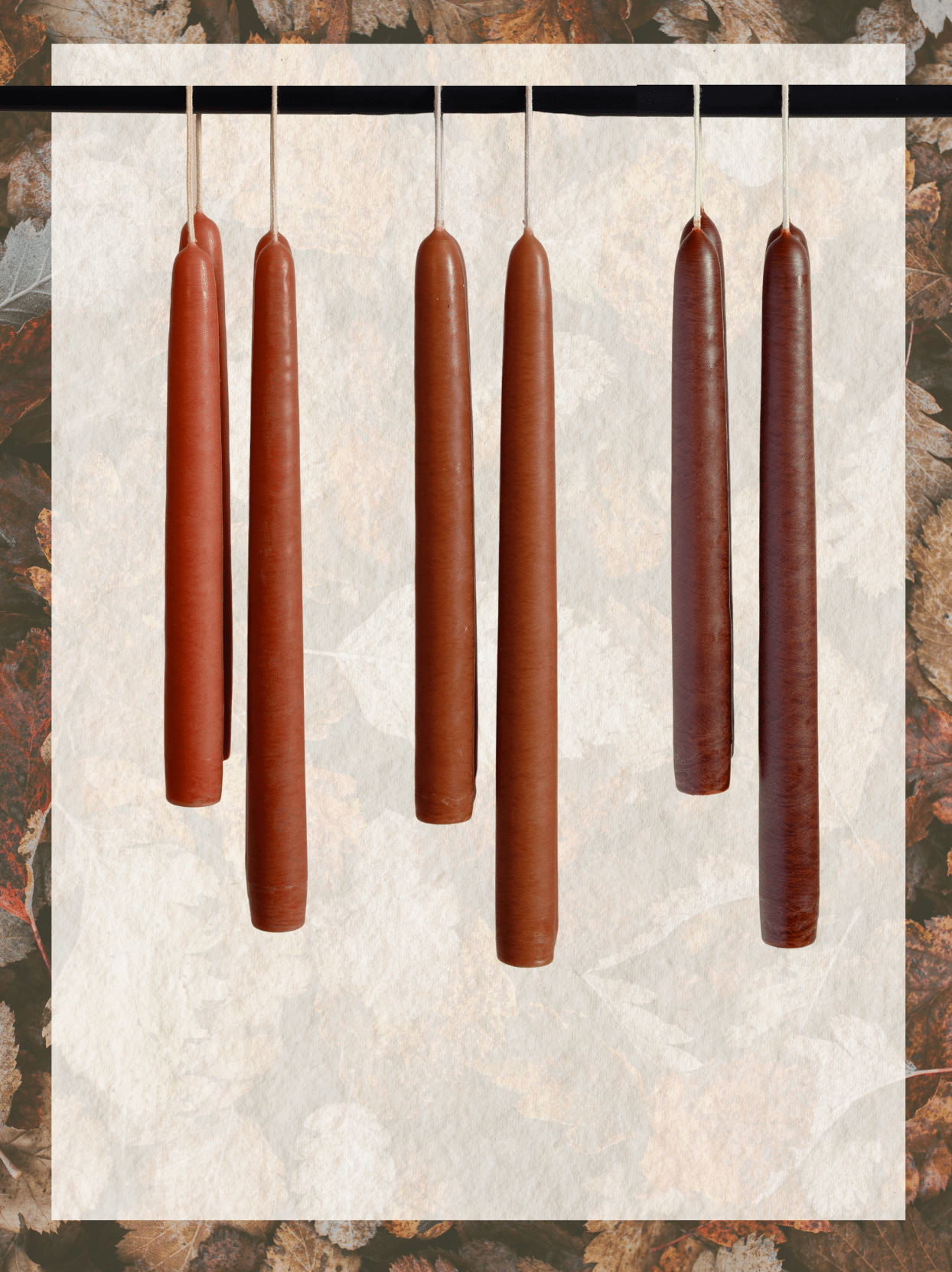 Hand-dipped autumn taper candles in Clay, Camel, and Umber, shown as a set of three for cozy seasonal styling.