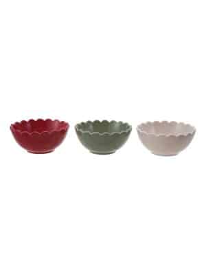 Three scalloped-edge stoneware bowls in red, green, and white displayed together on a white background.