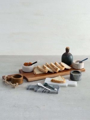 Wood Board With Braided Handle styled with charcuterie and neutral stoneware accents