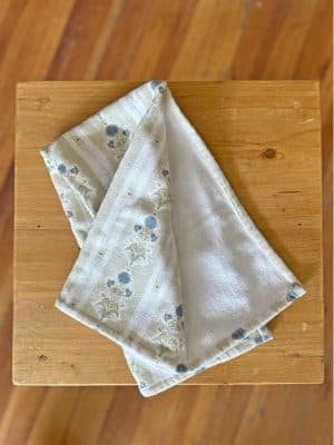 Cottage Floral Towel top view showing the top floral pattern design and the terrycloth white underside.