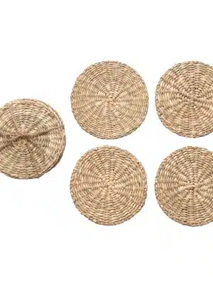 Set of four round hand-woven seagrass coasters, with one tied together in a natural twine bundle.