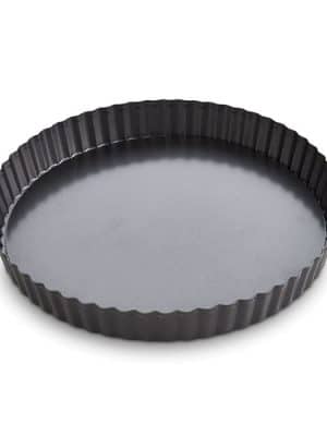 Side angle of the assembled black nonstick quiche pan with fluted edge