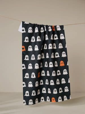 Emotional Boos Geometry Towel with white and orange ghost pattern on black background.