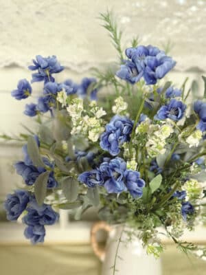 Blue Blossom Bush and Cream Wild Flower & Grass Bush styled together in a vase with layered greenery for a full, garden-inspired arrangement